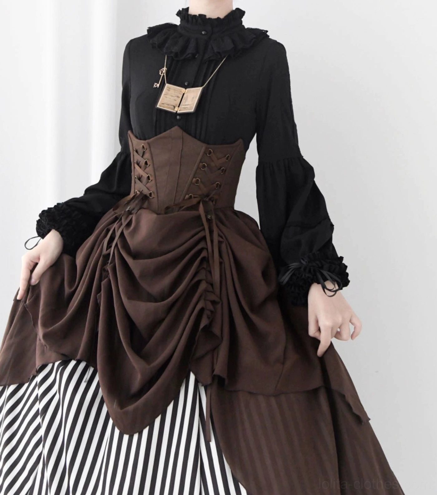 Ruffled hem and cuff detail of classic Lolita blouse showing layered ruffle construction, lace trim accents, and soft feminine silhouette design elements