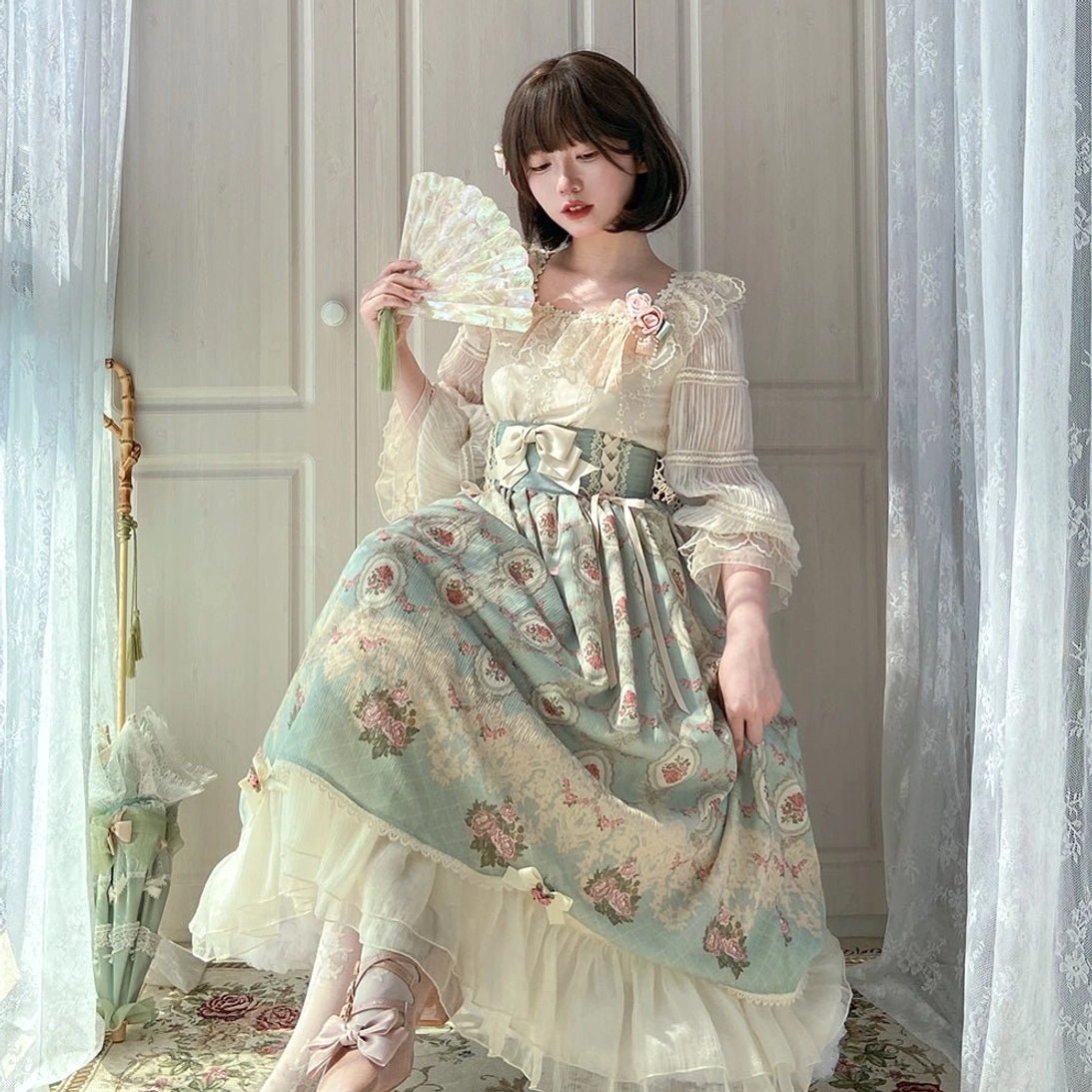 Seated side view of Lolita blouse and skirt coordinate showcasing elegant silhouette with lace details and formal styling