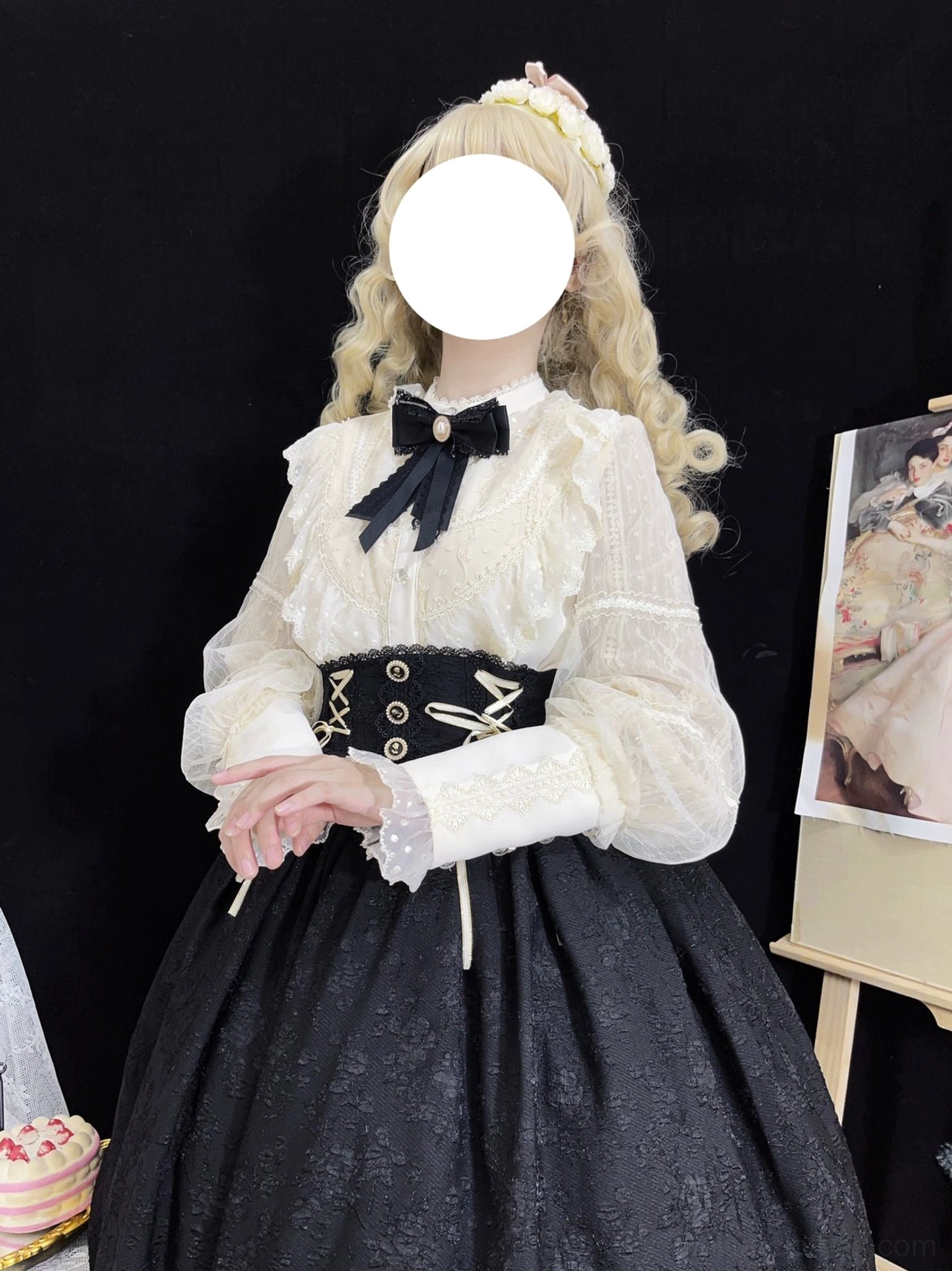 Detailed side view of Lolita blouse and coordinated skirt ensemble showing black bow tie at collar, lace-trimmed cuffs, sheer lantern sleeves, and golden lace-up straps on black corset waistband