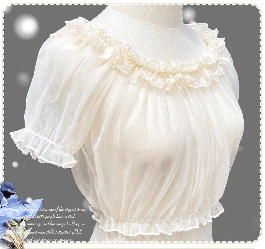Lolita mesh blouse front three-quarter view showing ruffled neckline bubble puff sleeves with neat cuffing and elasticated bottom hem on dress form