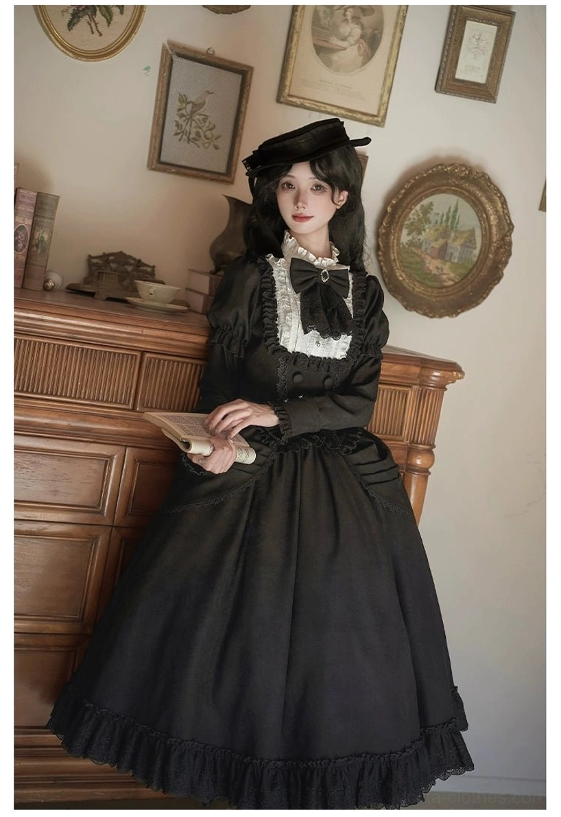 Close-up detail shot of white ruffled collar and lace trim on lolita blouse showing fine craftsmanship and contrast white detailing against black fabric