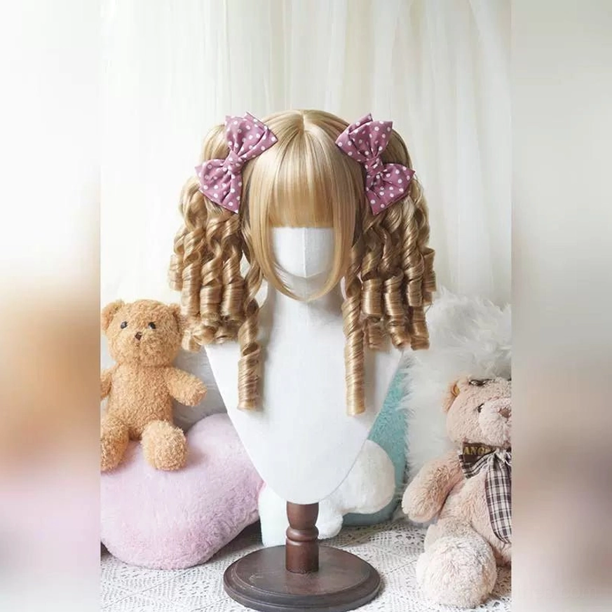Milk Tea Blonde Lolita detachable curl ponytail bob wig with pink polka-dot twin bows and tight spiral ringlets shown on mannequin with soft plush background