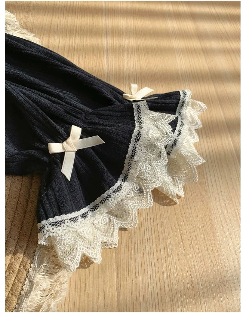 Detailed close-up of lolita bolero sleeve cuffs showing elastic opening with adjustable sizing, lace ruffle trim and refined knit fabric construction