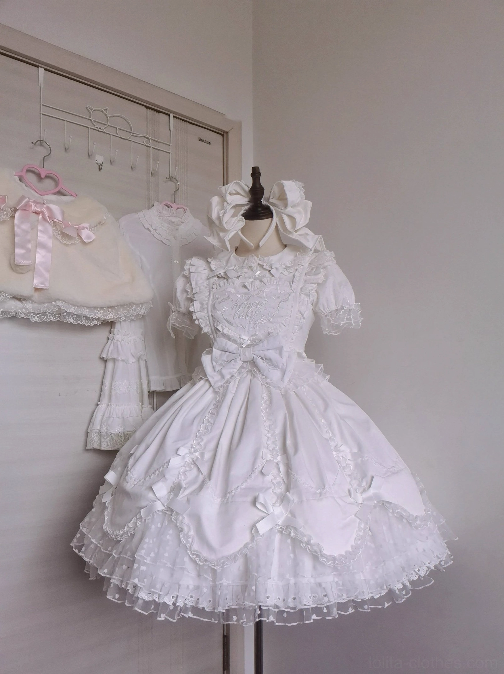 Sweet Lolita bonnet and KC accessory displayed together showing variety of style options