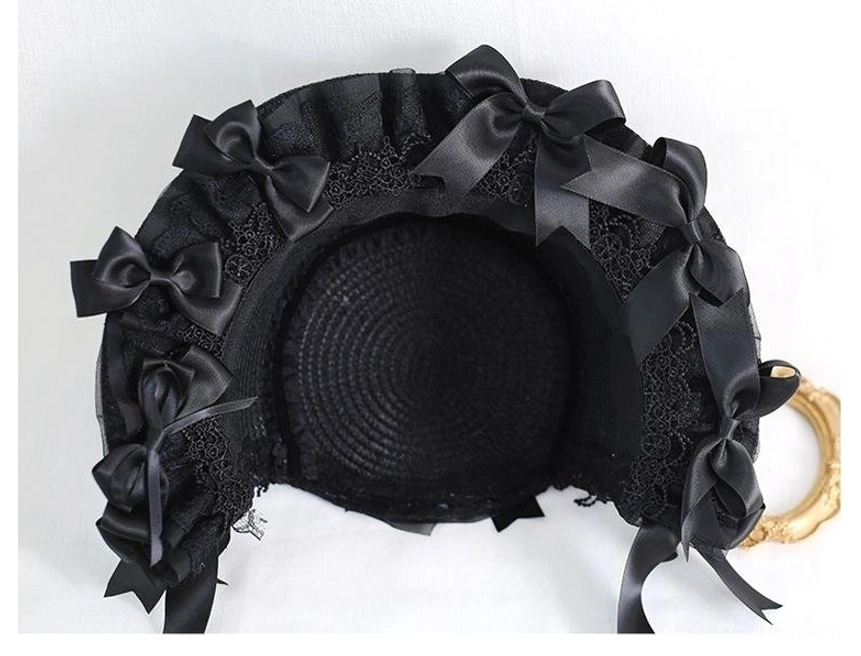 Black lolita lace bonnet rear view showing woven straw base multiple black satin bows back styling