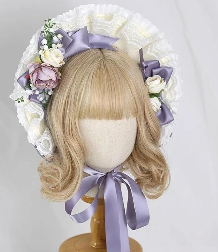 Front view of purple lolita bonnet with full lace ruffled brim, detailed satin ribbon lilac vine color bows, mixed artificial flower decorations, adjustable long straps