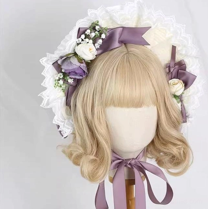 Smoky purple and ivory lolita lace bonnet with full ruffled lace brim, purple satin bows, mixed artificial floral ornaments, and long purple adjustable neck ties