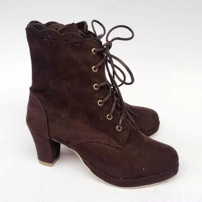 Side detailed view of paired Lolita suede boots showing complete metal eyelet lace-up design, rounded toe shape, chunky block heel construction, and coffee brown suede finish