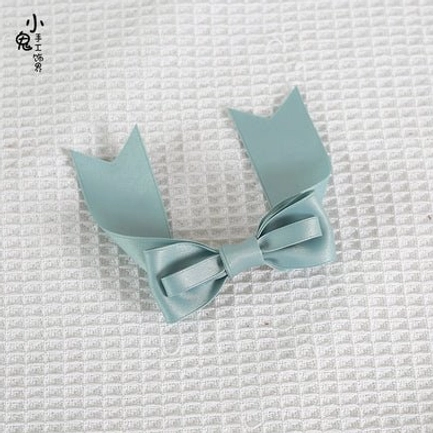 Lolita bow hair clip satin fabric close-up detail shot showing texture and finish quality for J-fashion accessories