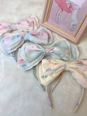 Lolita bow hairbands and clips with pastel colors, puppy prints, lace and pearl trim details on velvet backdrop