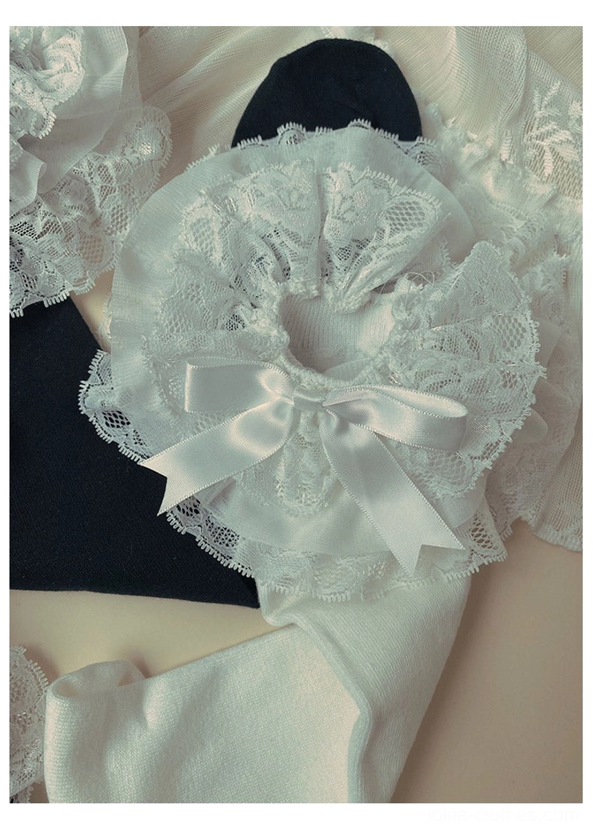 Lolita lace trim bow sock accessories close-up flat lay black and white color sets large ruffled lace trim with satin bow soft fabric texture