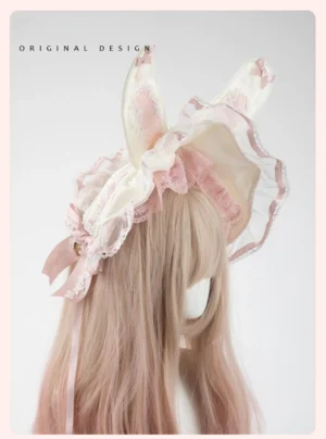 Lolita bunny ear bonnet headdress right side profile showing ruffled design, hanging bell ornament and long satin ribbon tails on mannequin