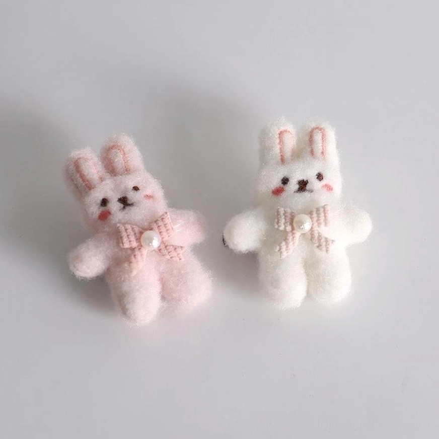 Mini plush lolita bunny ear hair clip set pair back three-quarter view blonde bob wig mannequin tiny fluffy white bunny dolls pink ears bow ties pearl details