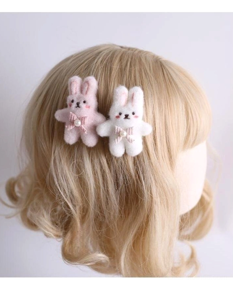 Lolita bunny ear headdress collection flat lay display showing multiple style options pink white color palette cute kawaii aesthetic japanese fashion accessories