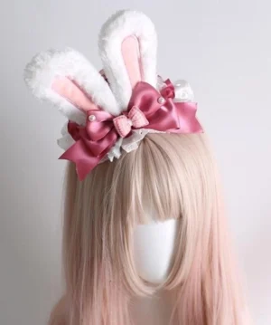 Lolita pink white gradient bunny ear headband front eye-level view blonde mannequin plush white ears checkered pink inner panels decorative satin bows lace base trimmings