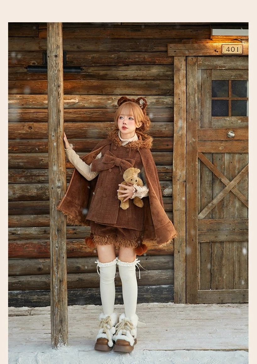Winter lolita cape back view highlighting fluffy tail accent, rear bow placement options and structured silhouette achieved through fabric weight and construction