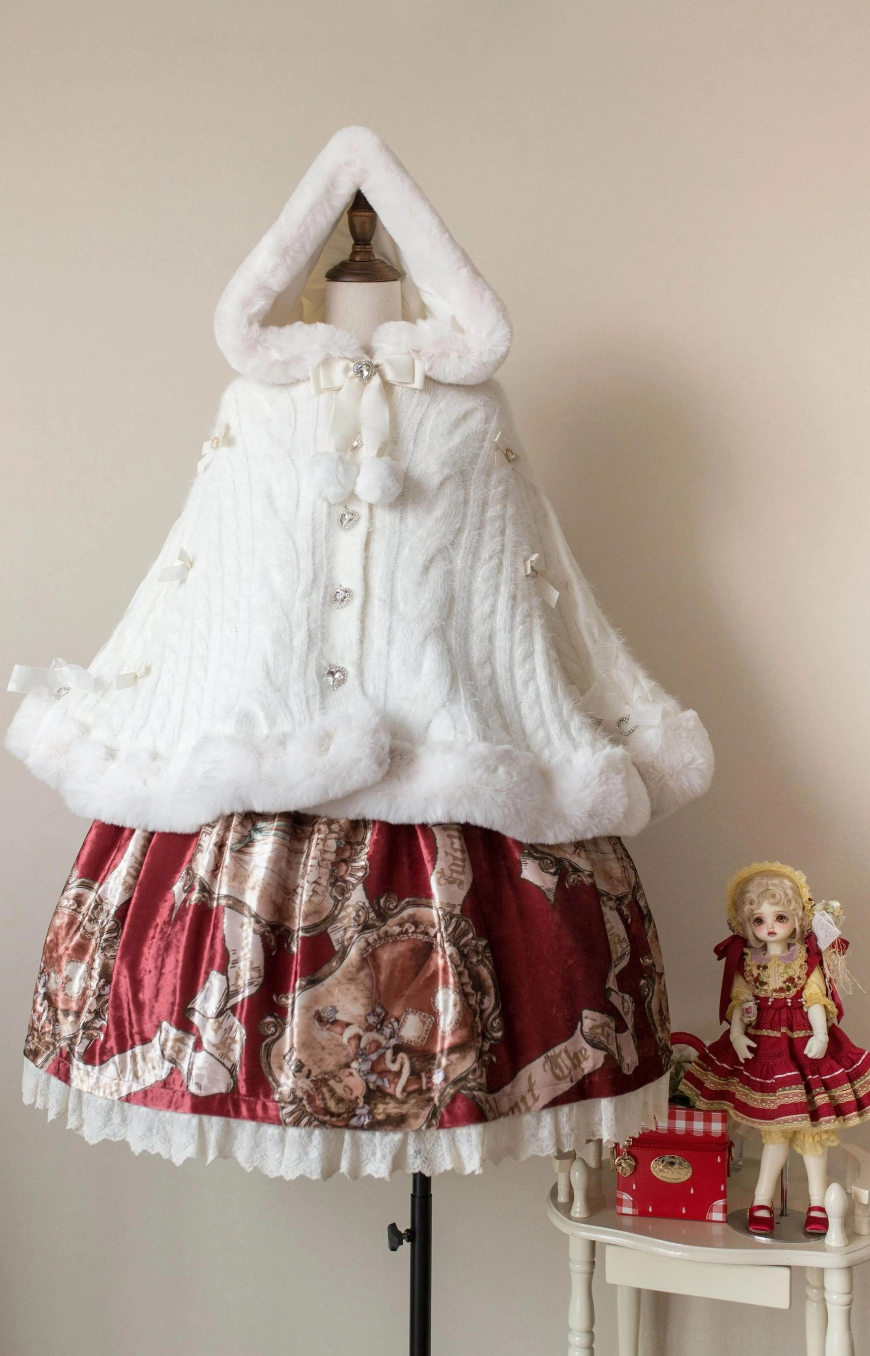 Lolita winter cape coat faux fur trim close-up highlighting premium plush white fur edges on hood, cuffs, and hem with dimensional texture detail