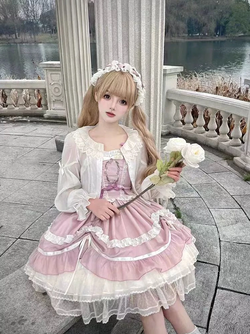 Lolita cape sleeveless design elegant silhouette Victorian-inspired classic black white style timeless fashion piece