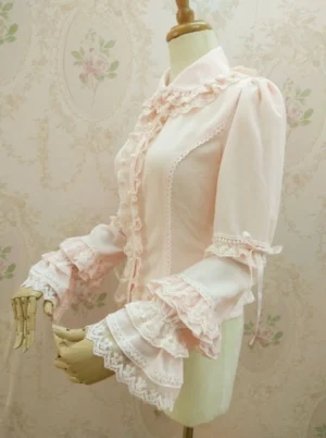 Lolita blouse left side view showcasing fitted waist silhouette lace trim details and layered ruffle cuffs with ribbon