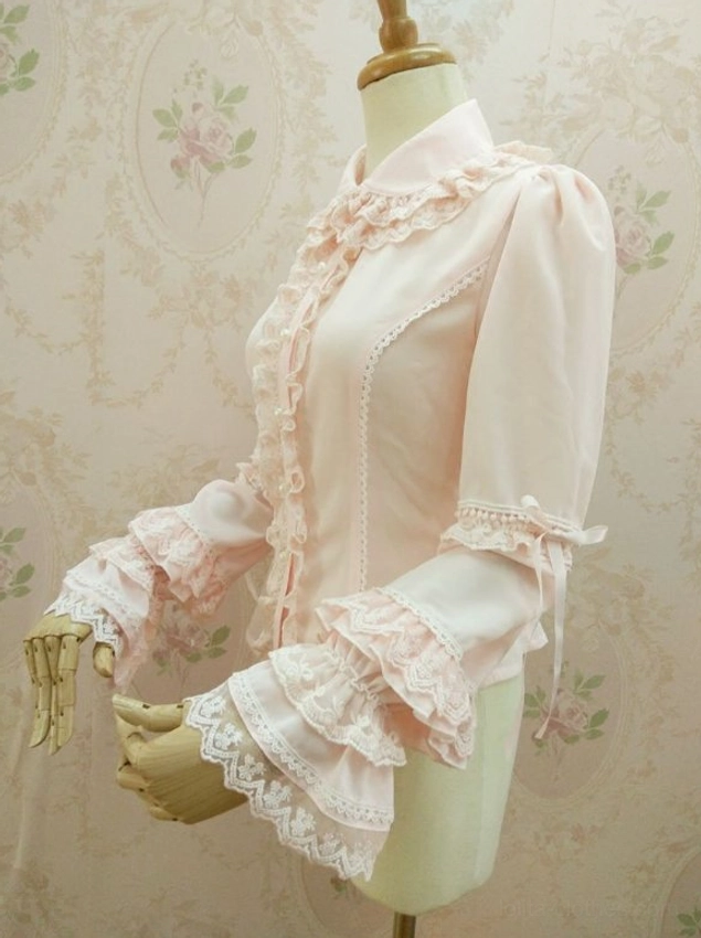 Lolita blouse left side view showcasing fitted waist silhouette lace trim details and layered ruffle cuffs with ribbon
