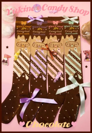 Chocolate-themed lolita over-the-knee cotton socks flat lay display with pink studio backdrop and decorative candy props