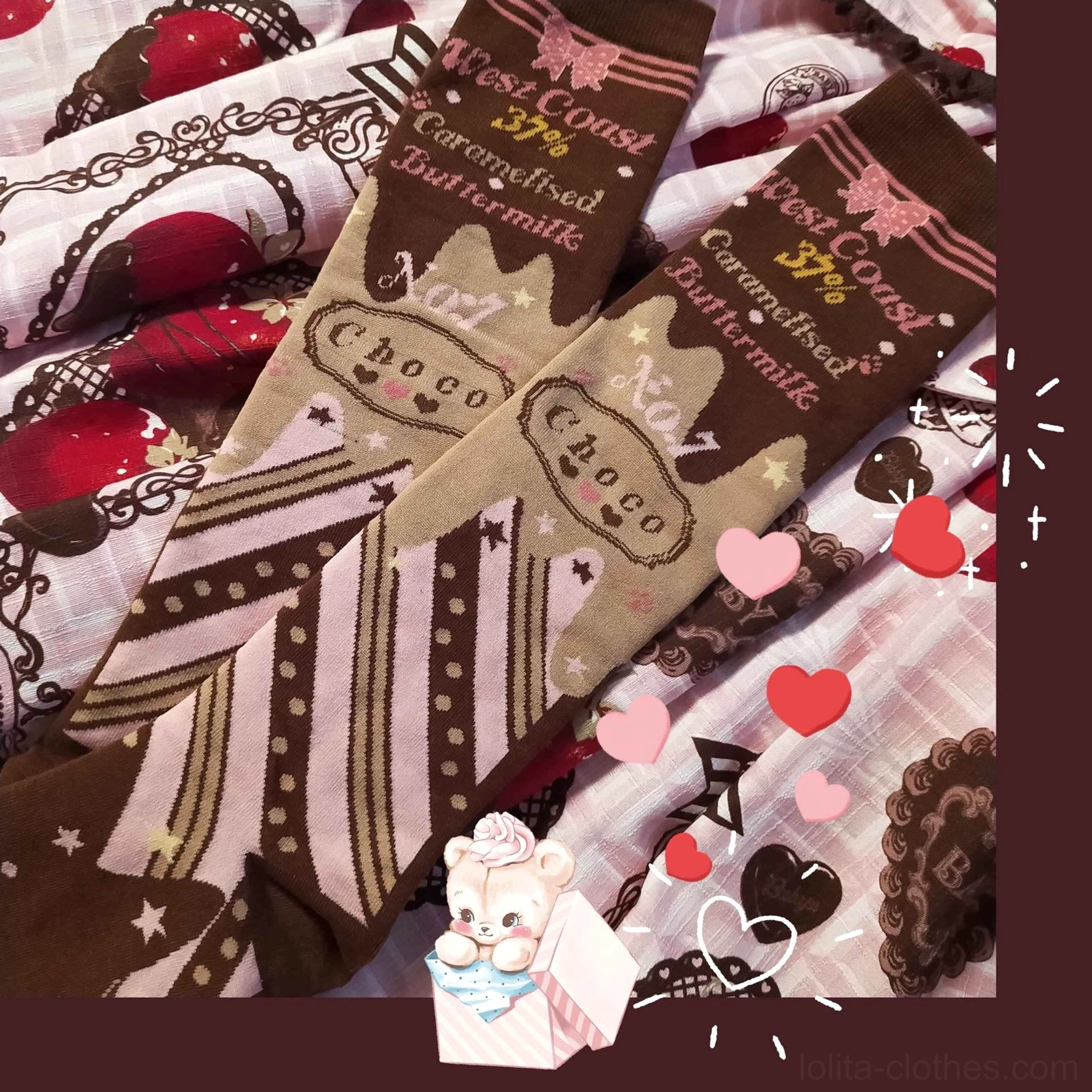 Two pairs chocolate lolita socks close-up flat lay on heart and strawberry print fabric with cute bear prop decoration