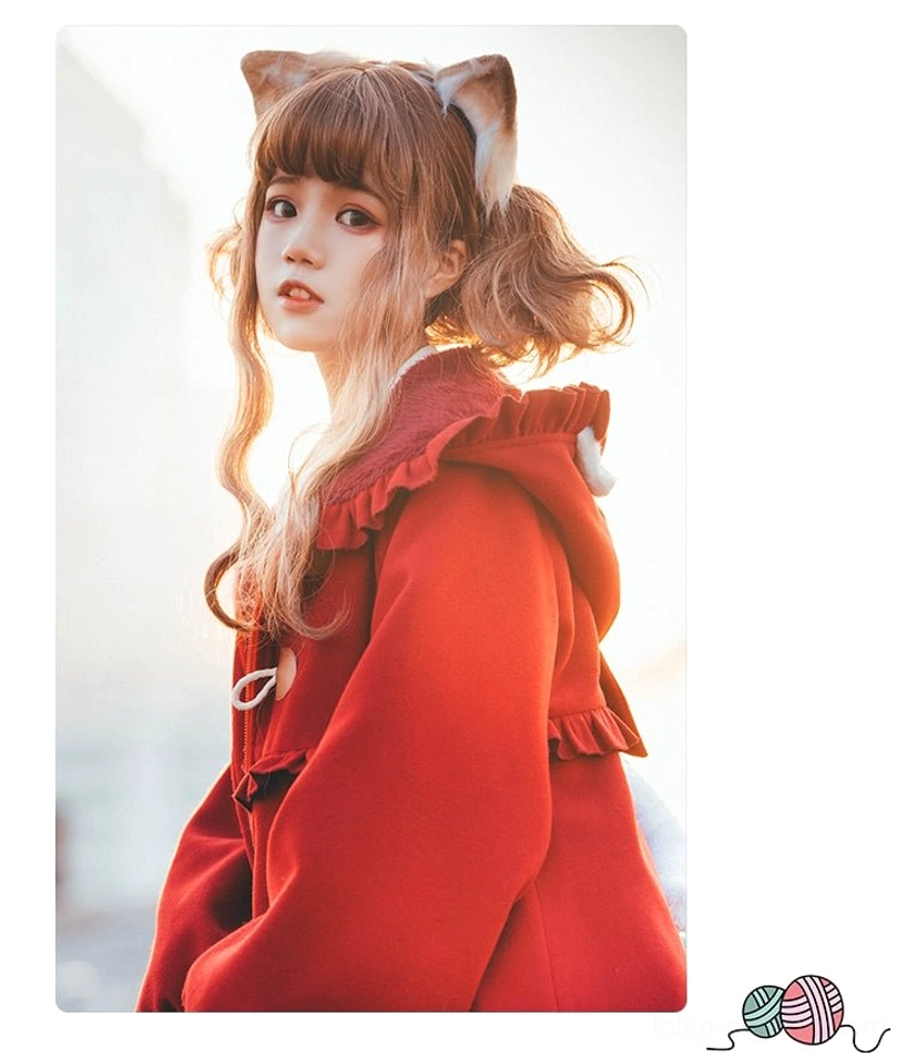 Close up detail red lolita coat cat ear hood ruffled hood trim horn toggle button woolen fabric texture upper body side view