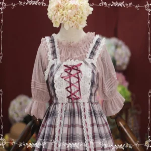 Pink plaid lolita jumperskirt with matching dot mesh inner blouse set styled on mannequin with lace accents and wine curtain backdrop