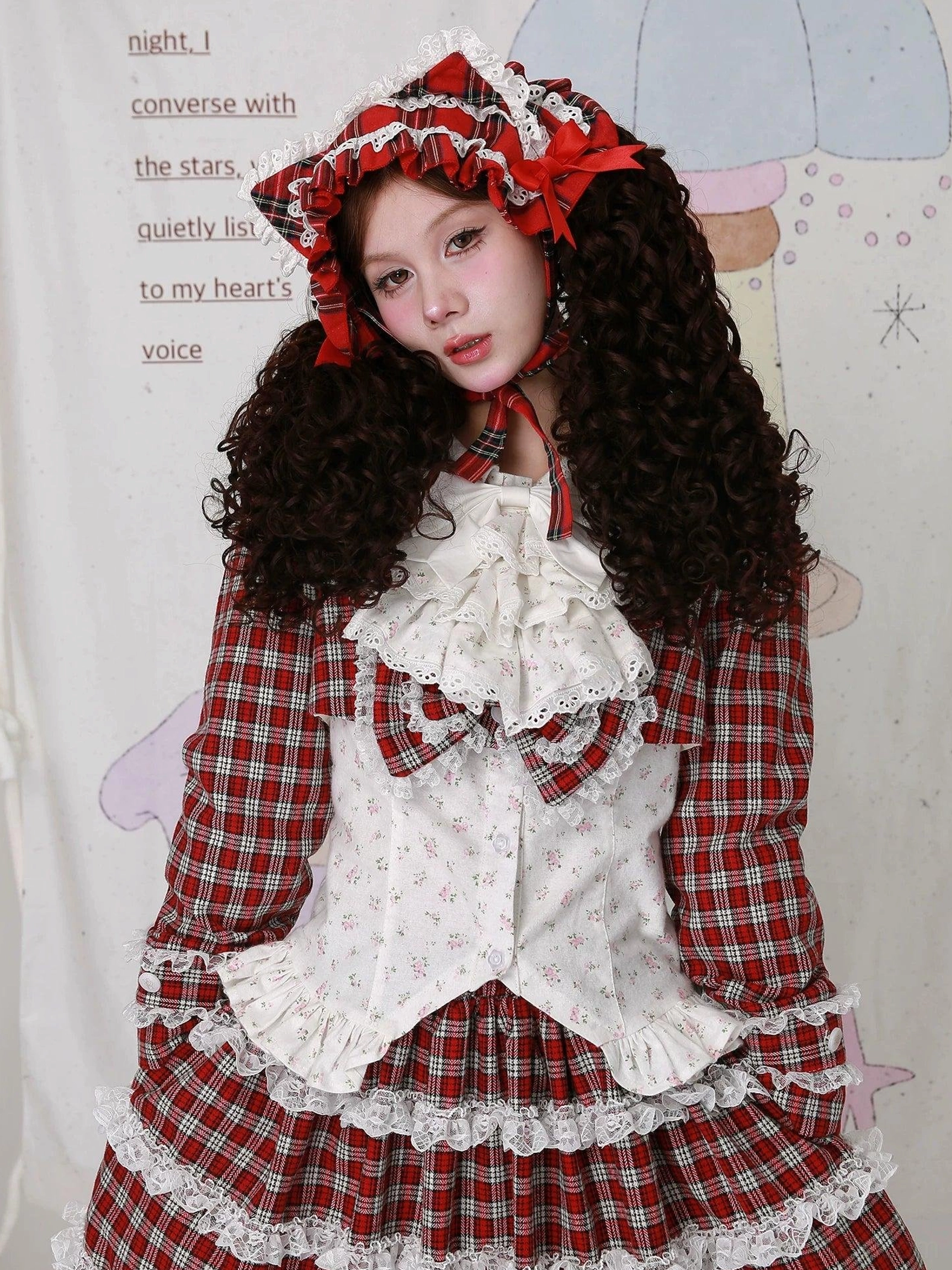 Vintage Lolita coordinate styling with floral blouse and red plaid skirt - model wearing lace-trimmed layered plaid skirt with tiered ruffles, complete Lolita outfit with gingham bonnet and neck ribbon