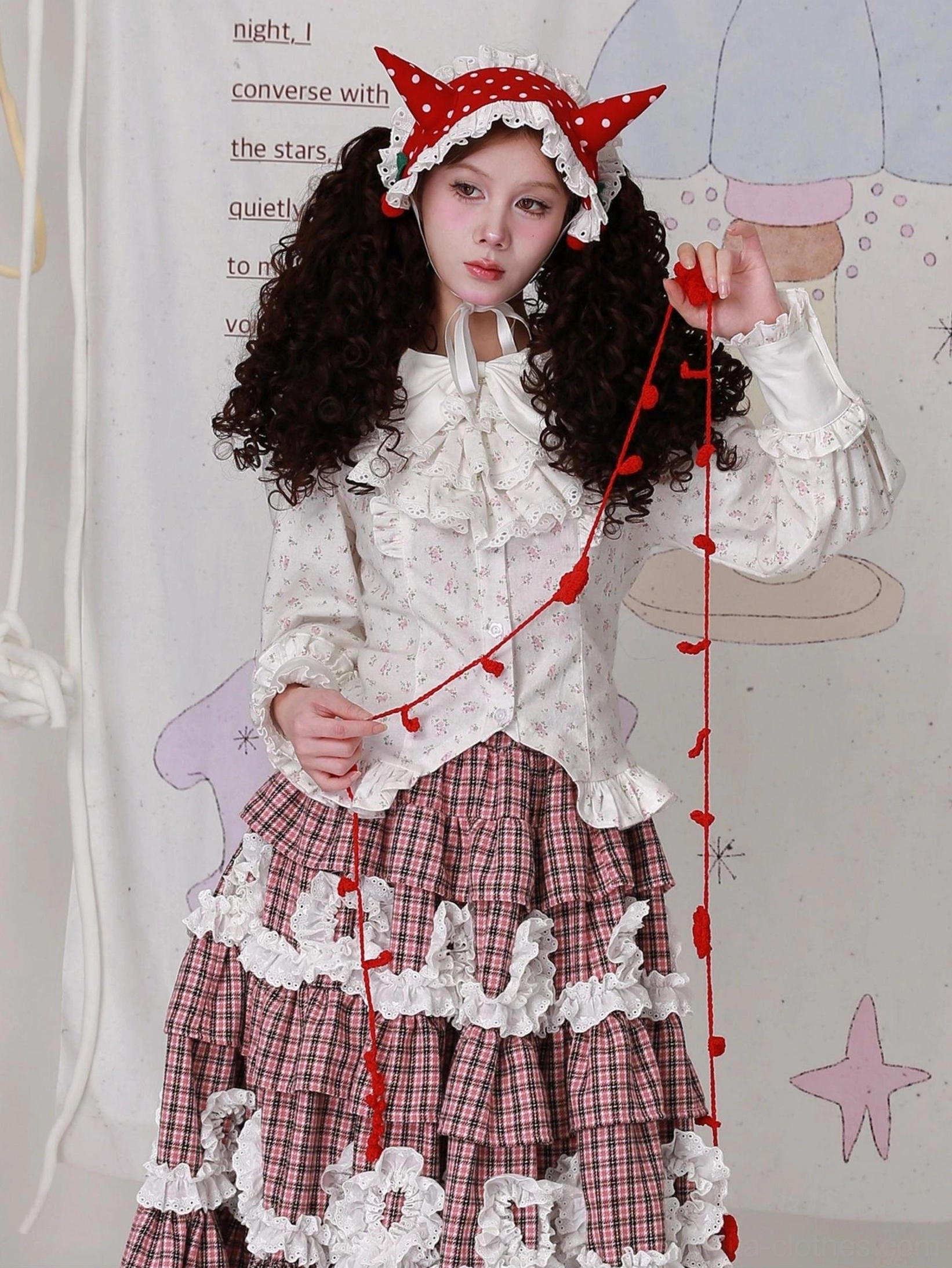 Close-up of Lolita blouse construction showing ruffled collar, decorative bow accent, brushed cotton material, and traditional Old School Lolita aesthetic design features