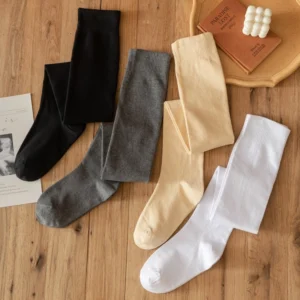 Four-color assorted lolita knee-high cotton stockings flat lay display black grey beige white solid colors soft ribbed texture
