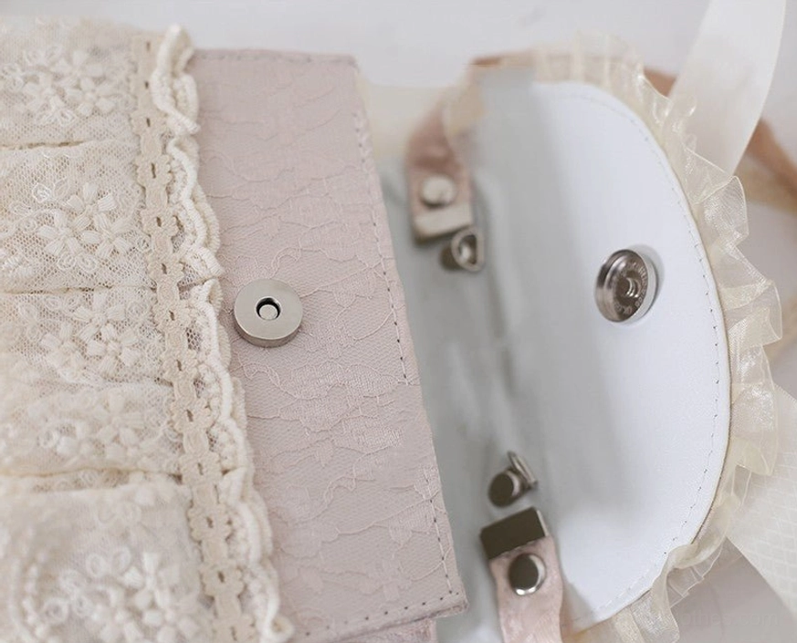 Elegant lolita daisy pearls chain handbag construction detail showing hand-stitched seams and delicate embroidery work