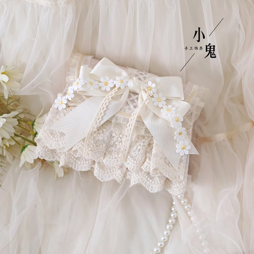 Handmade lolita daisy handbag featuring ruffled lace bottom and ornate satin bow, oblique side view with tulle backdrop