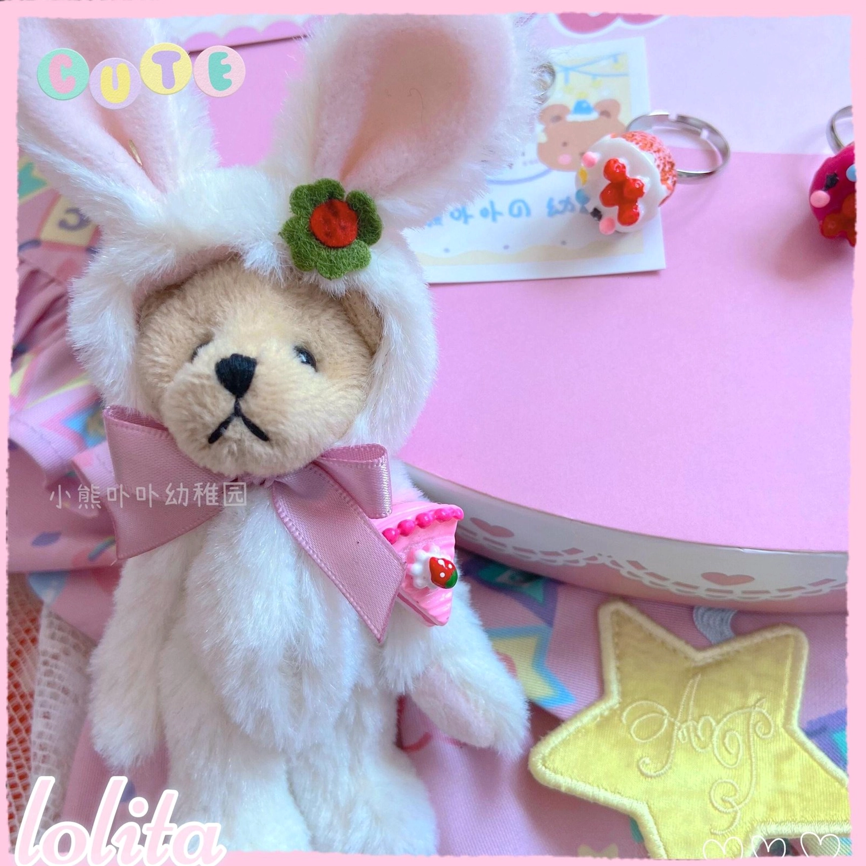Kawaii lolita dessert ring collection detail shots showing glossy resin construction and miniature cake heart star strawberry designs