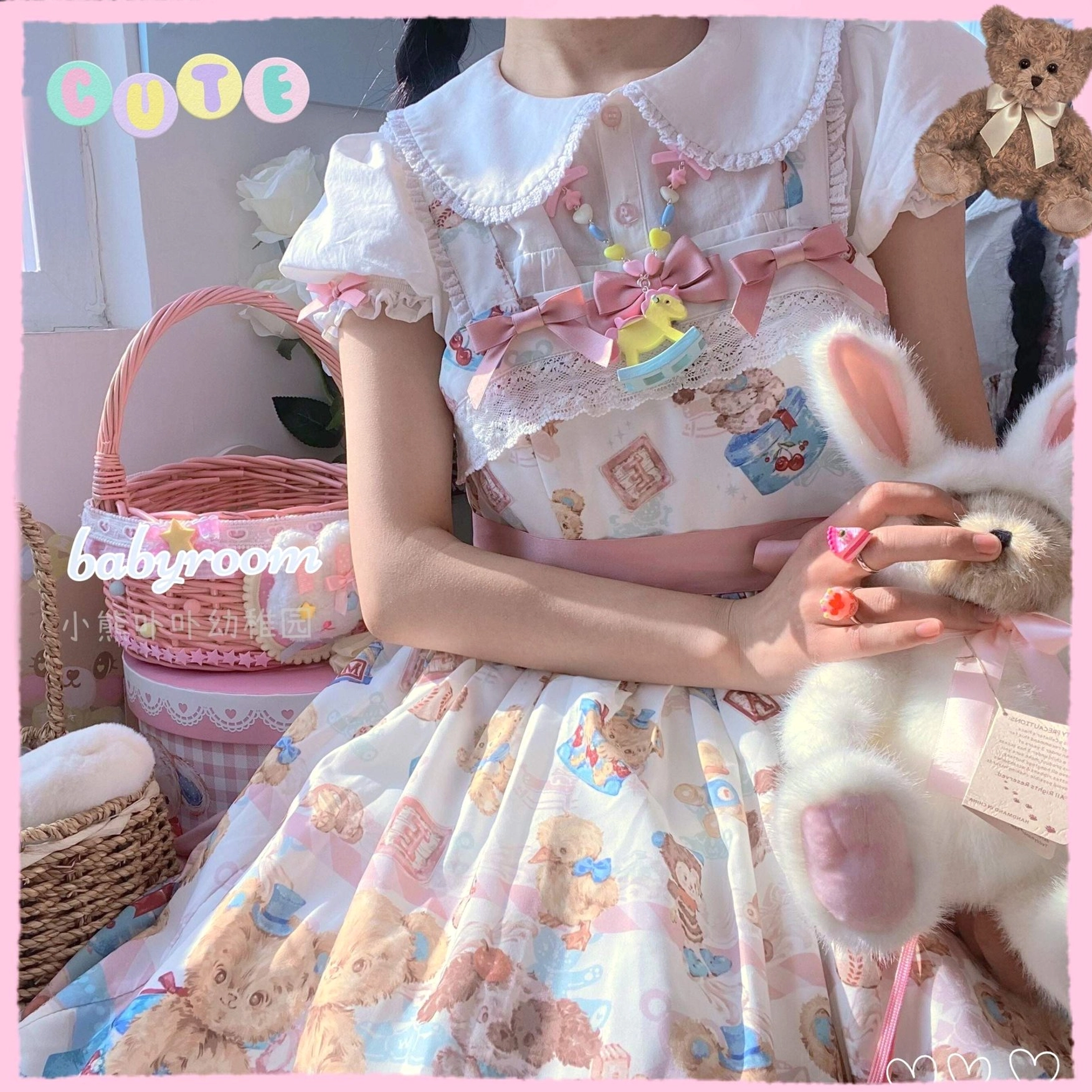 Model wearing multiple kawaii lolita dessert rings on fingers styled with pastel bear-patterned lolita dress and peter pan collar