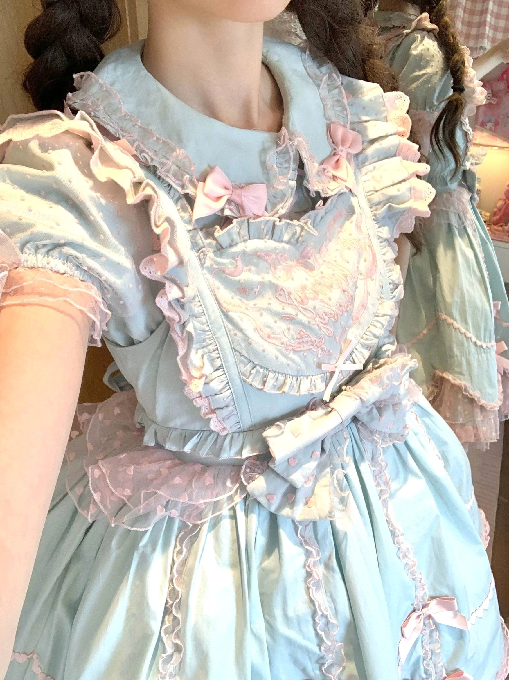Lolita jumper dress back view close-up displaying lace-up shirring construction and bow placement