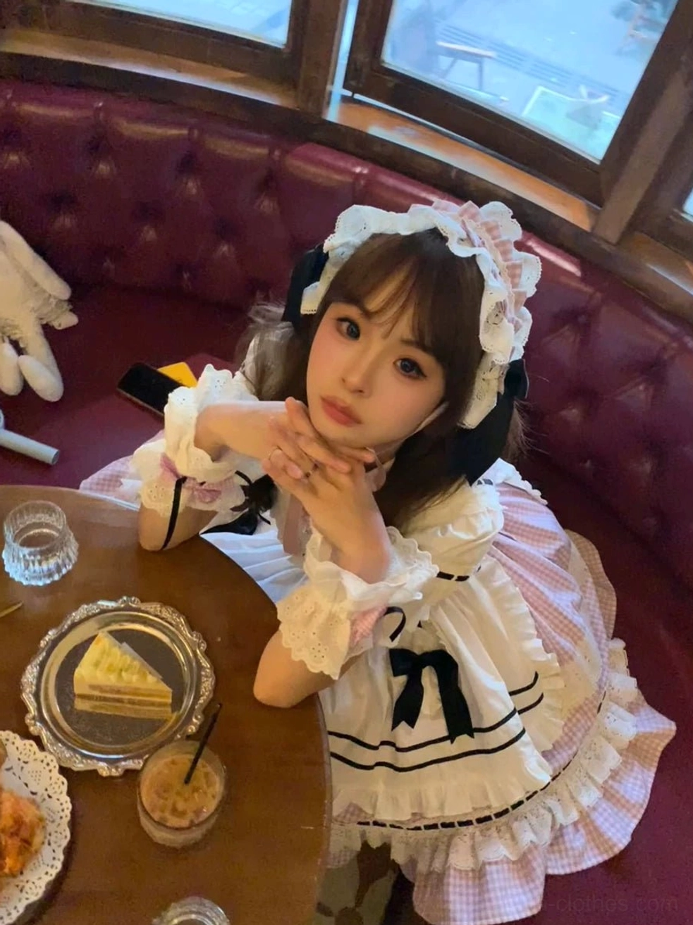 Worn classic Lolita dress coordinate ruffled lace headpiece wrist cuffs elegant pose vintage tea setting