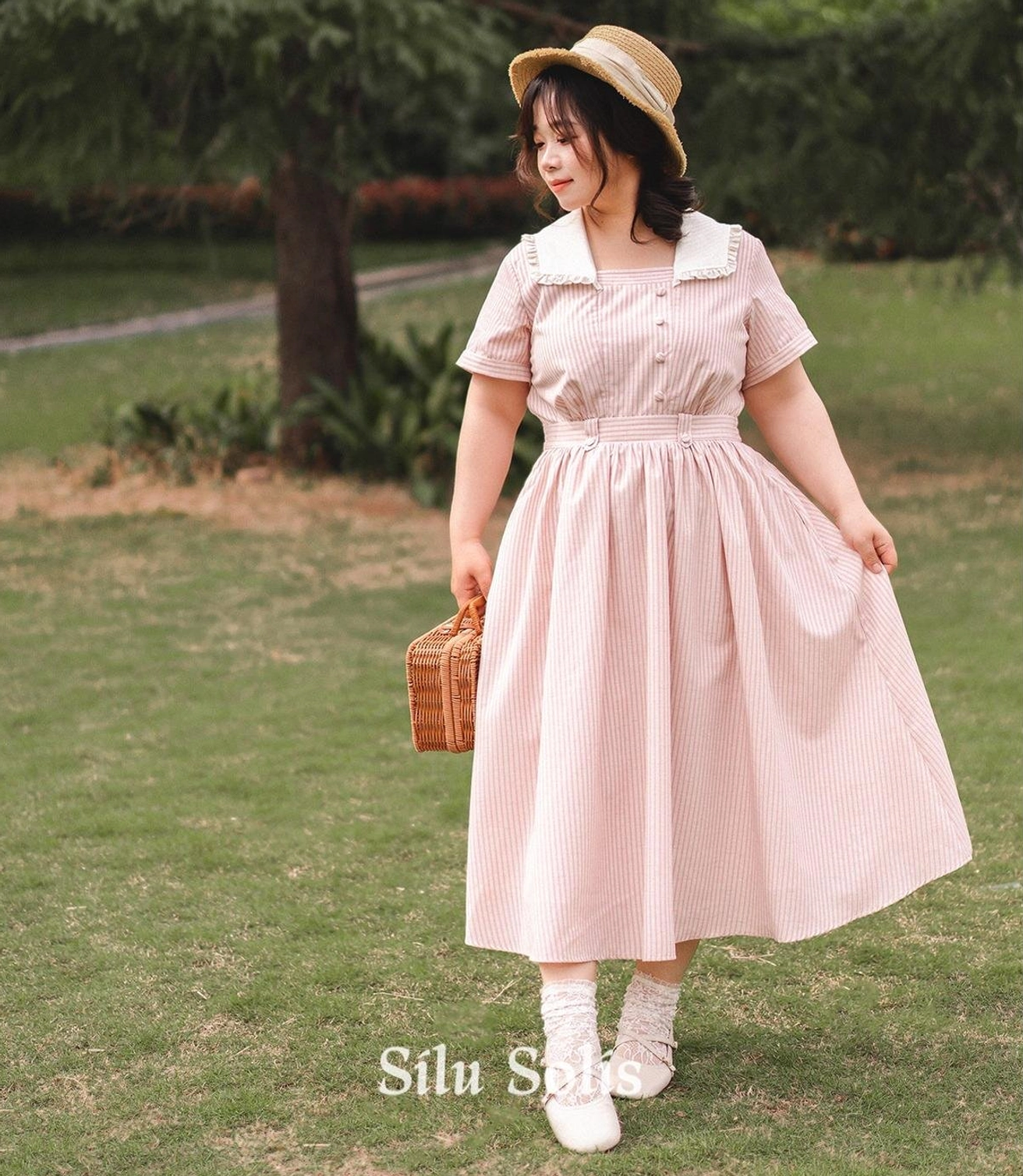 Side zipper closure detail shot showing functional side zip placement and interior construction quality of striped classic Lolita OP dress