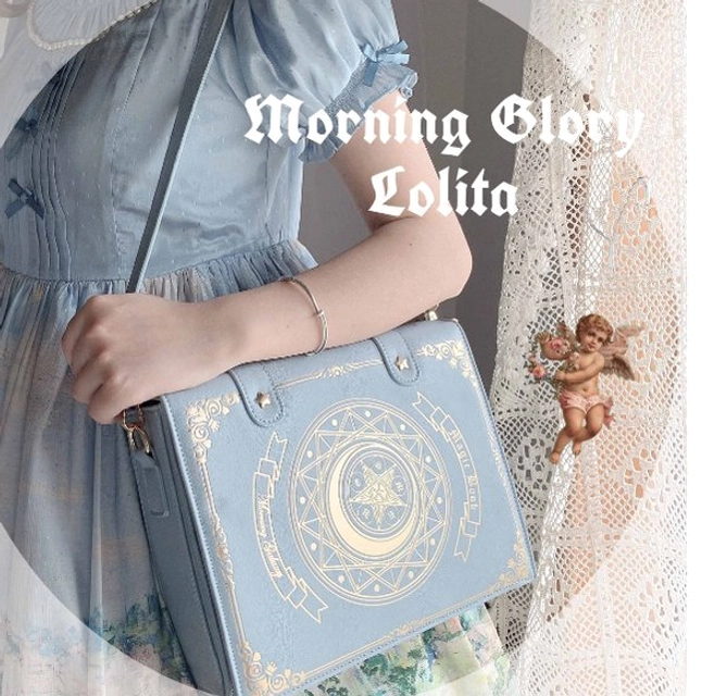 Lolita fashion grimoire crossbody clamshell bag with book silhouette structure and enchanting star-moon celestial motif decoration