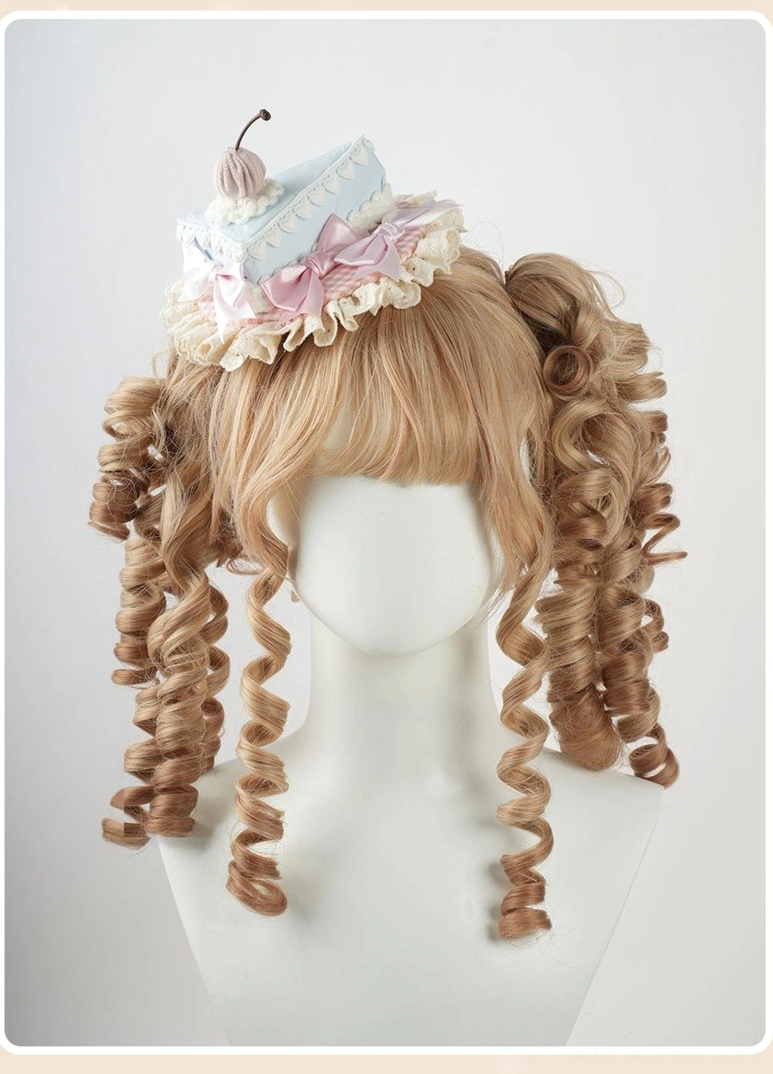 Lolita fashion headband with decorative bow and satin ribbon extensions in cream and pastel blue, suitable for sweet lolita coordinate styling and tea party events