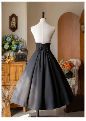 Back view of black A-line Lolita skirt with lace-up corset closure design and high-waisted silhouette vintage studio mannequin showcase