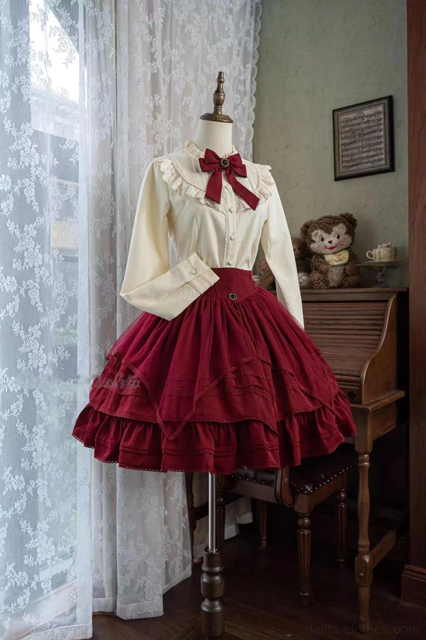 Lolita daily fleece blouse and ruffled burgundy skirt set front three-quarter display on dress mannequin with red bow collar vintage study room lace curtain plush decor