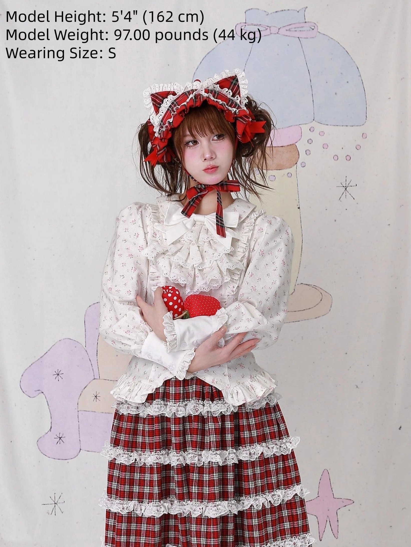 Lolita blouse and multi-layer tiered plaid skirt coordinate - model wearing size S showing lace-trimmed layered skirt hem, fitted ruffled blouse waist, and matching lace bonnet