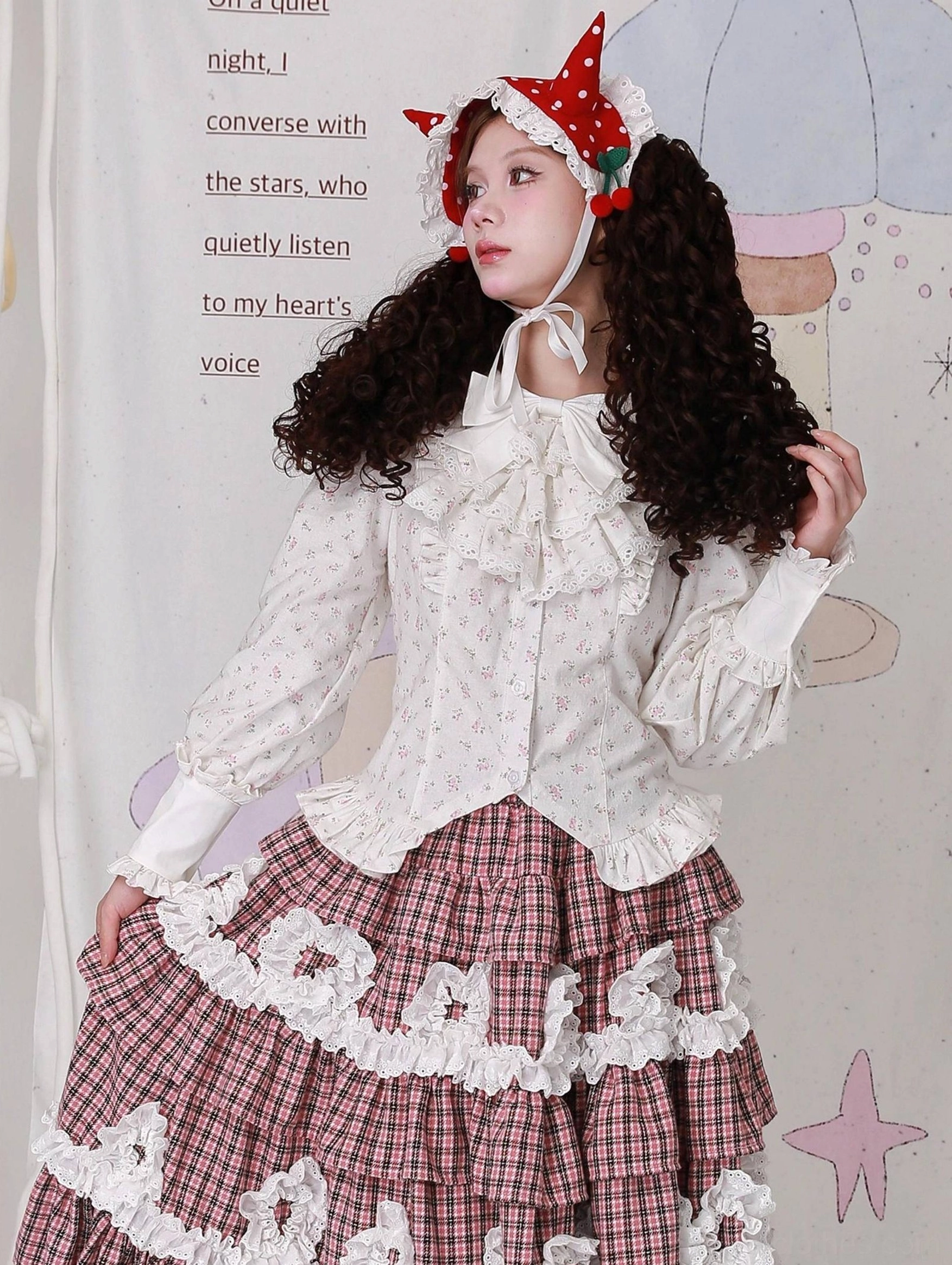 Side three-quarter view of Lolita coordinate featuring off-white floral blouse with ruffled front placket and brown plaid skirt with white lace-trimmed ruffled hem - alternative styling perspective