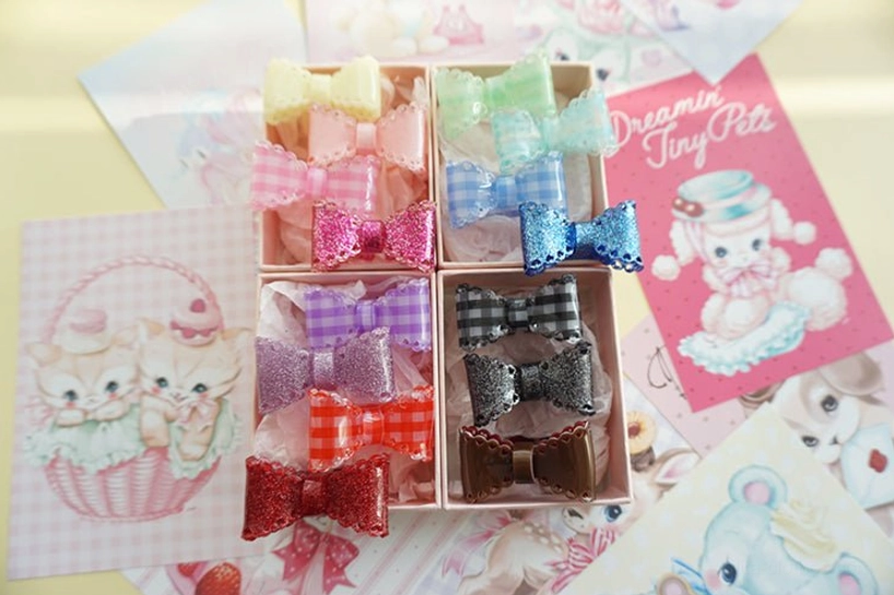 gingham bow hair clips full color range set overhead flat lay stored in split plastic trays vintage kawaii