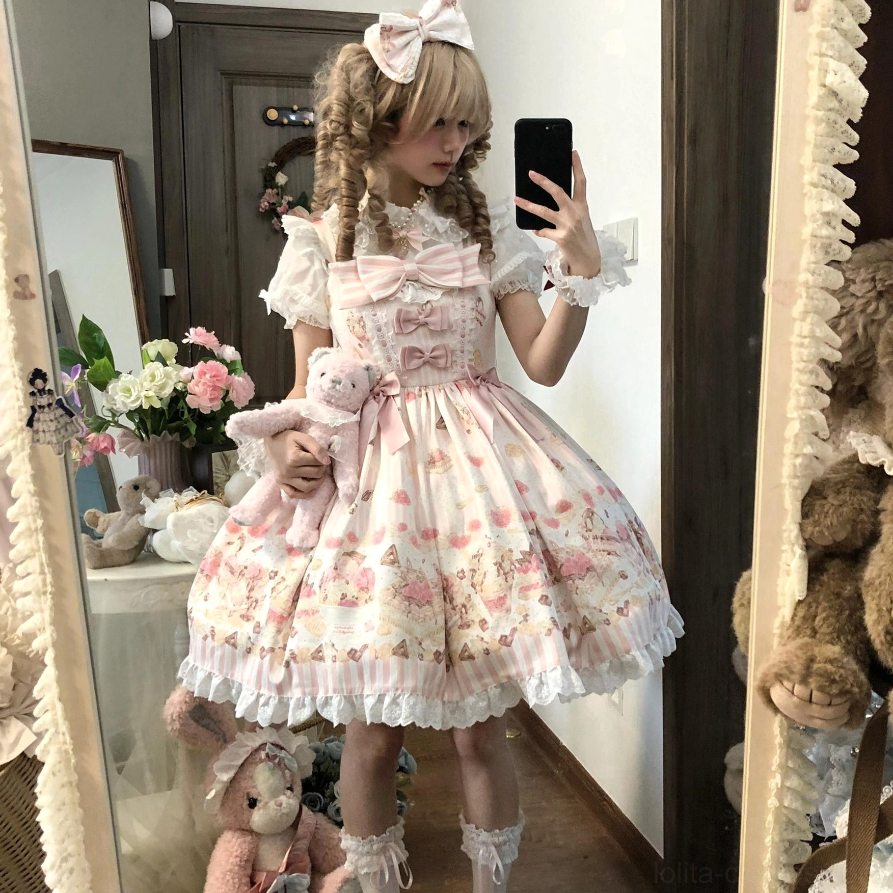 Sweet Lolita girl wearing Iced Strawberry Cheese JSK dress mirror selfie blonde curly twin-tail hairstyle pink bow hairpin lace inner blouse frilly socks bedroom styling