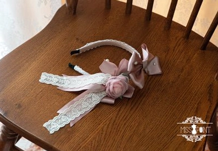 lolita hair bow and headband set featuring satin pink rose delicate lace ribbons and pastel pink bow ornament flat lay