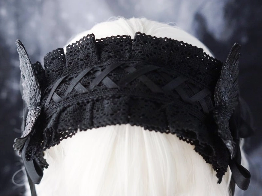 Gothic raven wing lolita hairband detail shot showing intricate lace work satin bow construction and adjustable ribbon mechanisms for lolita fashion