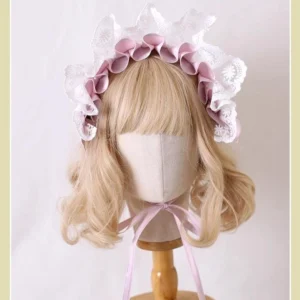 Sweet lolita hairband with dusty pink rosettes white hollow lace border and adjustable pink neck tie strap front view