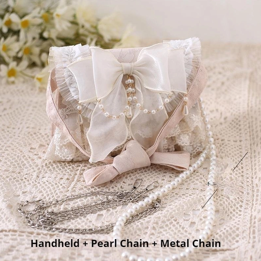 Flat lay lolita handbag showing dual carrying options handheld pearl chain and metal chain on daisy lace tablecloth